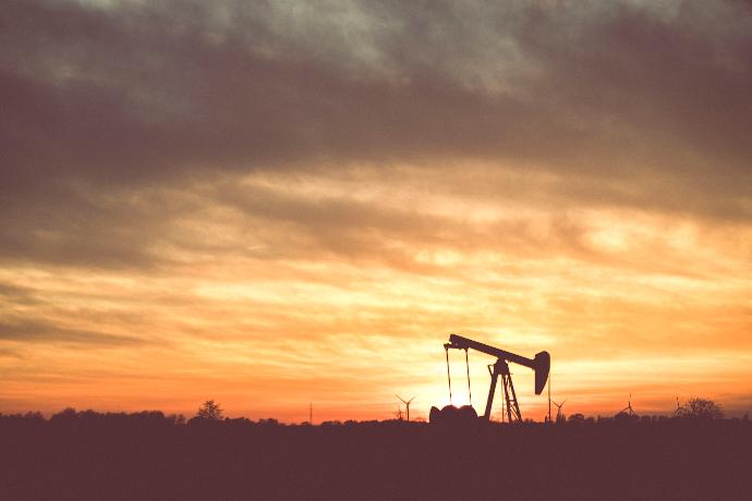 silhouette of a person standing on a ladder during sunset